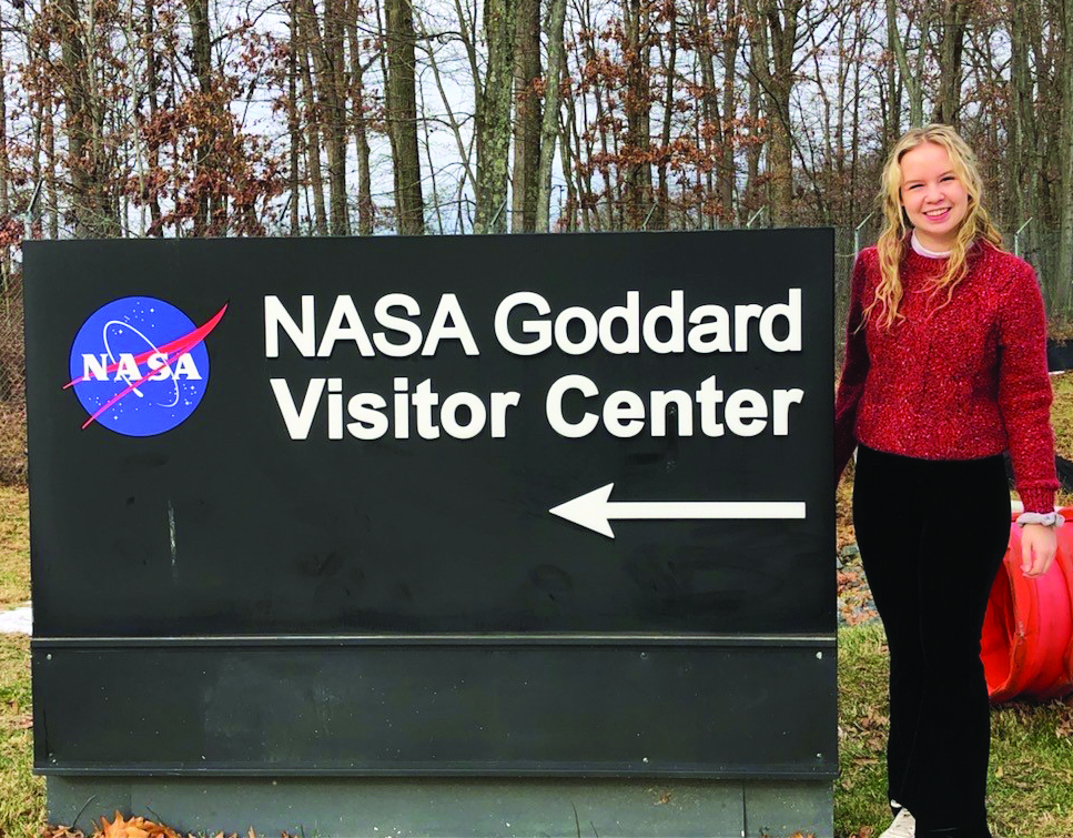 Annabelle next to NASA sign